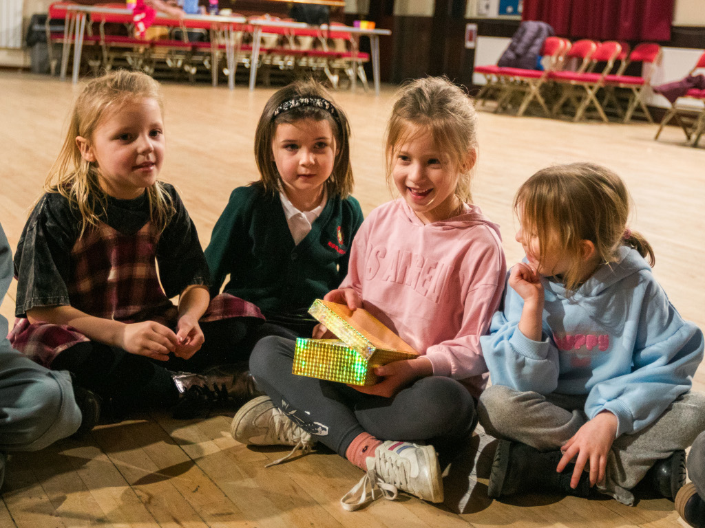 Students in Clitheroe practicing acting skills in a vibrant classroom