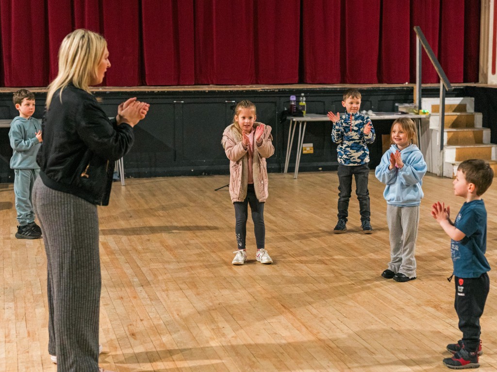 Children acting out scenes in Clitheroe, part of their drama tuition