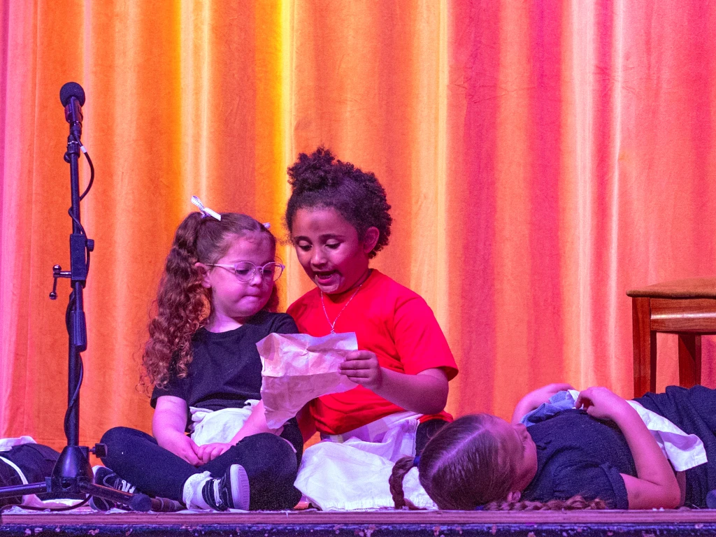 Whalley students performing on stage during an acting class